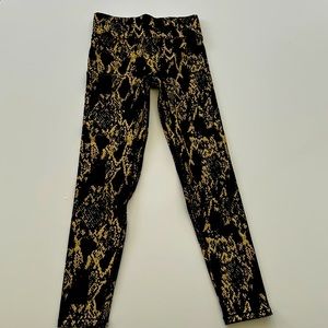 NOLI snakeskin tights. reflective for color changing and safety.